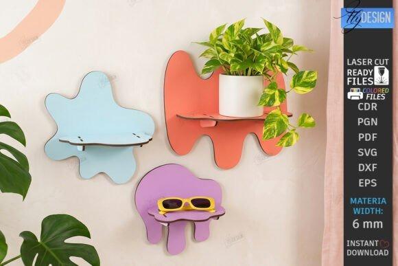 Laser Cut Wall Decor Shelves Colorful laser cut wall decor shelves in abstract shapes holding a plant and sunglasses