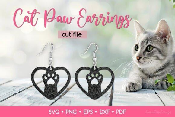 Laser Cut Jewelry Cat Paw Earrings Laser cut jewelry cat paw earrings shaped as paw prints inside hearts on wooden surface with a cat nearby