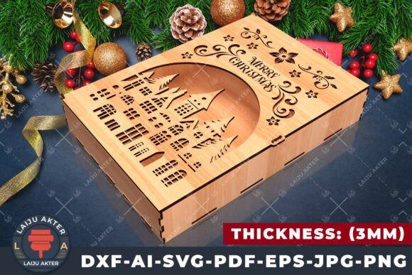 Laser Cut Box Christmas Design Laser cut box with intricate Christmas village design and Merry Christmas engraving on wooden surface