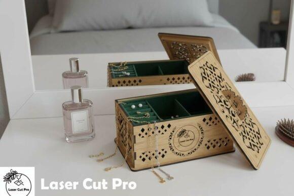 Laser Cut Jewellery Box laser cut jewellery box with intricate geometric lid and multiple compartments on a white vanity table
