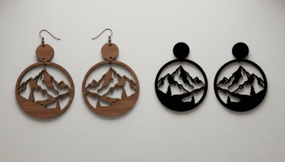 Mountain Adventure Earrings — laser cut jewelry Mountain Adventure Earrings laser cut jewelry in wood and black material with engraved peaks and trees
