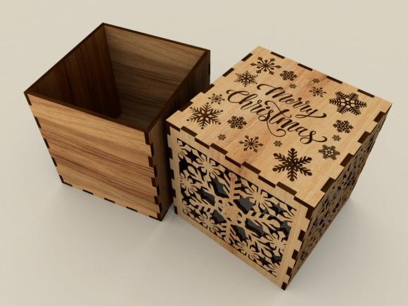 Laser Cut Gift Box Designs Laser cut gift box designs with snowflake patterns and Merry Christmas text on natural plywood