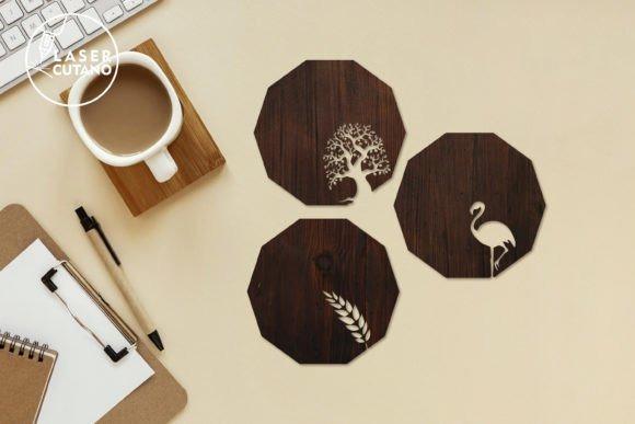 Laser Cut Wood Coasters — laser cut wood projects Three dark wooden laser cut coasters with tree, flamingo, and wheat designs alongside a coffee cup — laser cut wood projects