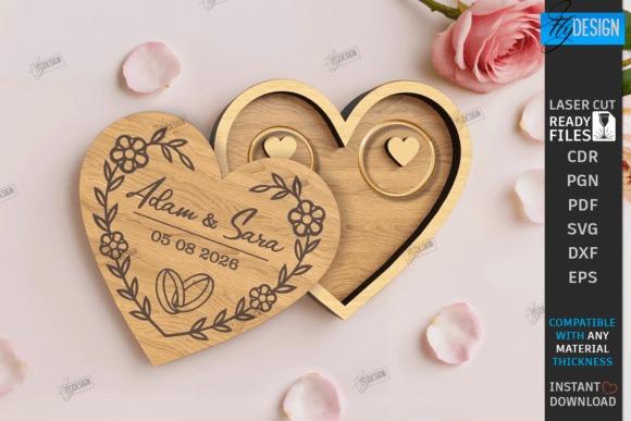 Laser Cut Jewelry Box Heart-shaped laser cut jewelry box with engraved names Adam & Sara, wedding date, and floral design