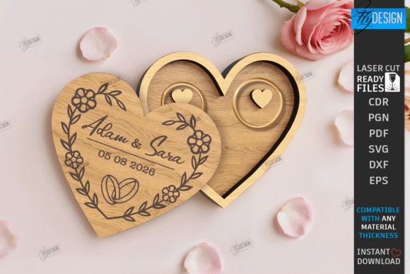 Laser Cut Box Wedding Ring Design Heart-shaped laser cut box with engraved names Adam & Sara and wedding date holding two rings