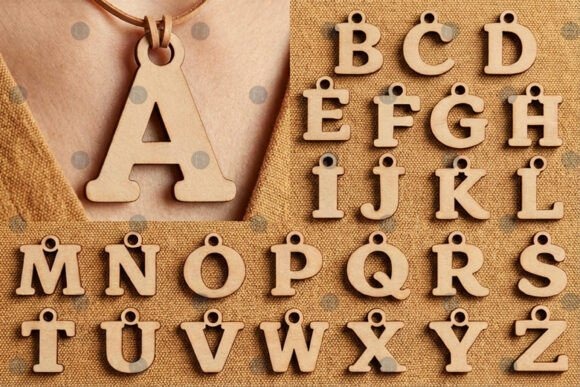 15 Laser Cut Pendant Ideas for Unique Handmade Jewelry 5 Laser cut pendant wooden alphabet letters A to Z arranged on fabric background with one pendant on leather cord