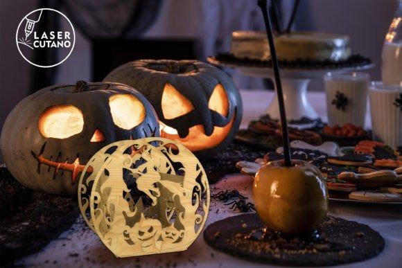 Halloween Laser Cut Candle Holder Halloween laser cut candle holder with witches and pumpkins on a decorated table with jack-o-lanterns and Halloween treats