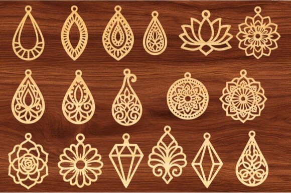 45 Best Laser Cut Acrylic Jewelry Ideas 7 Laser cut acrylic jewelry pieces with elegant, intricate designs in natural wood tone on dark wooden background