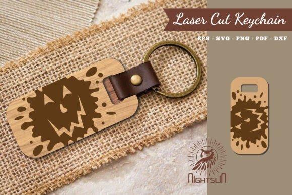 Halloween Laser Cut Keychain Halloween laser cut keychain with a carved spooky face on a rectangular wooden tag attached to a metal ring