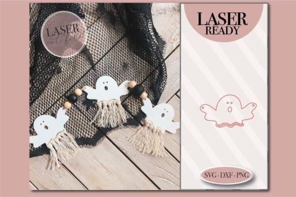 Halloween Laser Cut Ghost Garland — Halloween laser cut ideas Halloween laser cut ideas ghost-themed garland with wooden beads and tassels on black netting