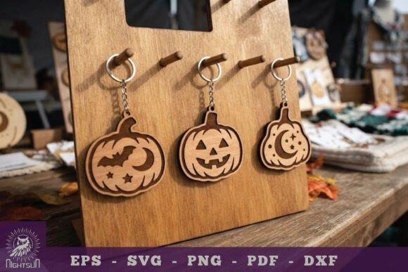 Halloween Laser Cut Keychains Halloween laser cut keychain set with three wooden pumpkin designs hanging on display