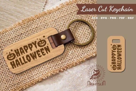 Halloween laser cut keychain Happy Halloween laser cut keychain with pumpkin faces on wooden tag and leather strap
