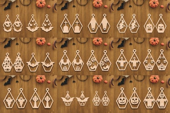 35 Halloween Laser Cut Wood Earrings Ideas 20 Halloween laser cut wood earrings in various spooky shapes arranged on a wooden surface with small pumpkins and bat