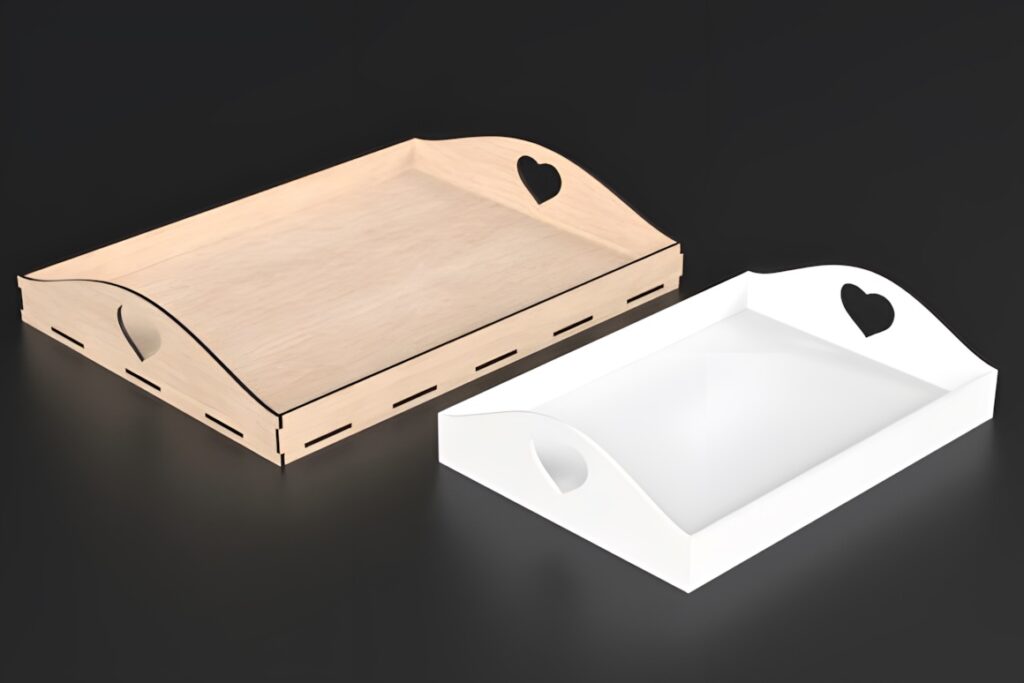 37 Laser Cut Ideas for Creative Maker Projects 37 Two laser cut serving trays with heart-shaped cutouts, one natural wood and one white, on a black surface