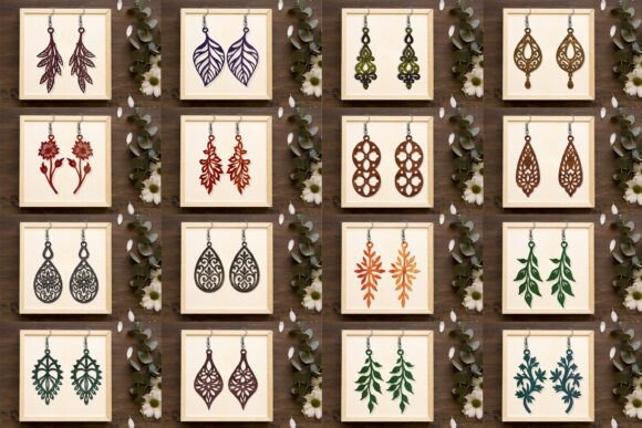 Laser cut wood earrings in floral and leaf designs displayed on wooden frames