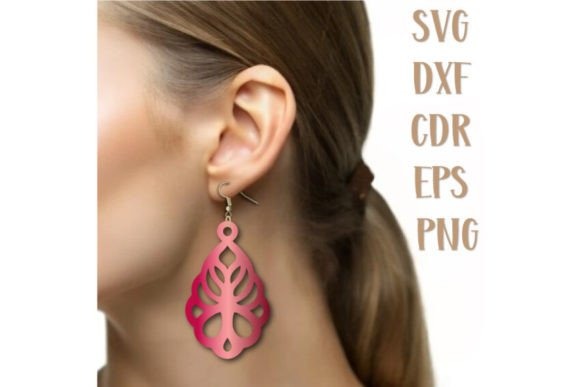 23 Laser Cut Wood Jewelry Ideas 32 Laser cut wood jewelry earring in a pink decorative design worn on ear