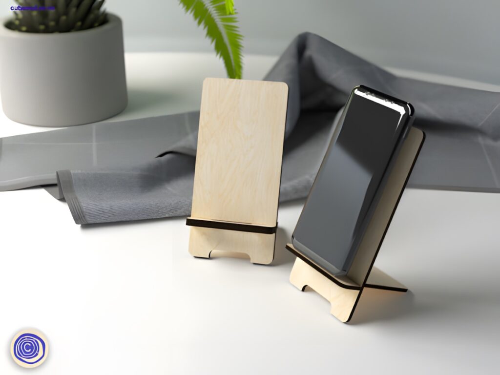 45 Laser Cut Files for Ready-to-Make Laser Projects 16 Laser cut files wooden phone stand with two thickness options holding a smartphone on a desk