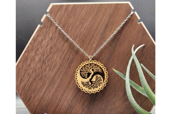 Laser cut necklace with intricate tree and bird design on wooden pendant