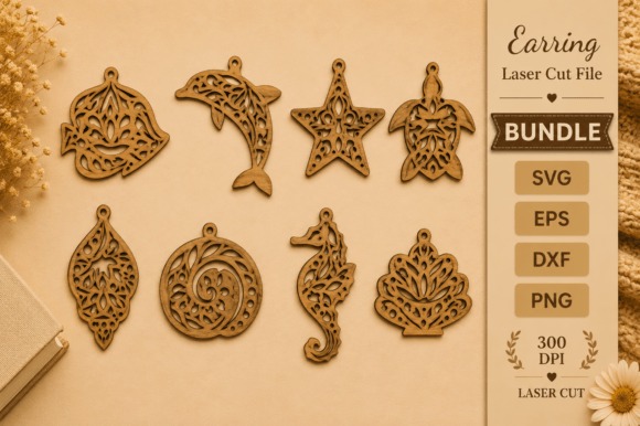 Laser cut wood earrings in various intricate animal and nature-inspired designs laid out on a beige surface