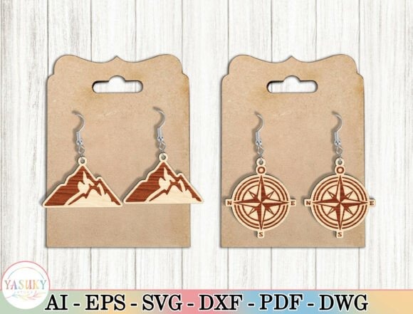Laser cut wood earrings featuring mountain and compass designs on display cards