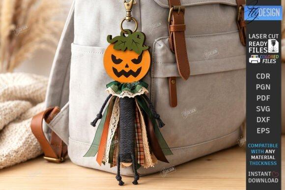 Laser Cut Halloween Keychain Laser cut halloween keychain with a pumpkin head and layered ribbon body hanging on a beige backpack