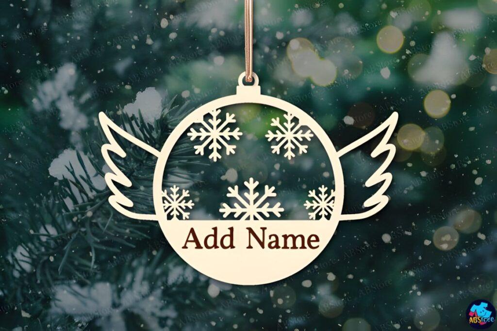54 Christmas Laser Cut Files for Festive Laser Projects 6 Christmas laser cut files ornament with snowflakes and wings hanging on tree with Add Name text