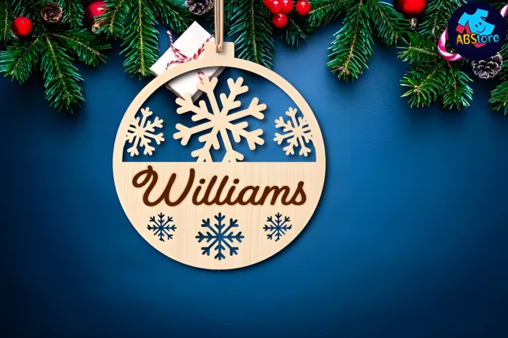 54 Christmas Laser Cut Files for Festive Laser Projects 17 Christmas Laser Cut Files wooden ornament with snowflakes and personalized name Williams hanging on pine branch