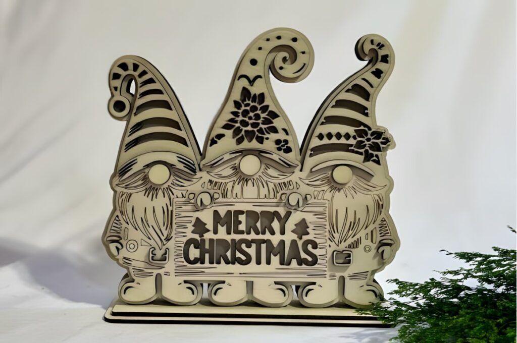 54 Christmas Laser Cut Files for Festive Laser Projects 60 Christmas Laser Cut Files layered gnome design holding a Merry Christmas sign with detailed hats and beards