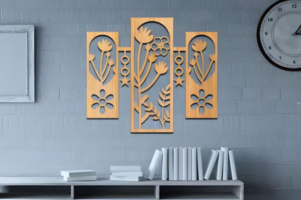 17 Laser Cut Metal Wall Art Panels for Modern Home Decor 9 Laser cut metal wall art panels with wildflower designs mounted on a gray brick wall above white books on a shelf