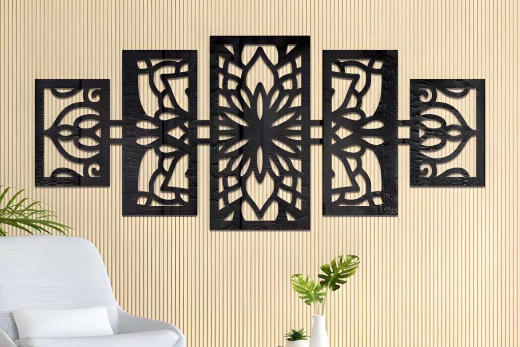 39 Outdoor Laser Cut Panels for Modern Outdoor Spaces 37 Black outdoor laser cut panels with symmetrical mandala design mounted on beige wall above white chair and green plants