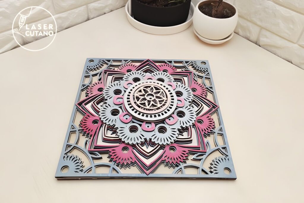 47 Laser Cut Wall Art Ideas for Stylish Home Interiors 26 Multilayer mandala laser cut wall art ideas with 11 layers in pink, white, and blue on a beige surface