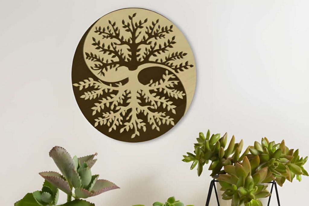 39 Outdoor Laser Cut Panels for Modern Outdoor Spaces 5 Round outdoor laser cut panel with tree design mounted on wall above green succulent plants — outdoor laser cut panels